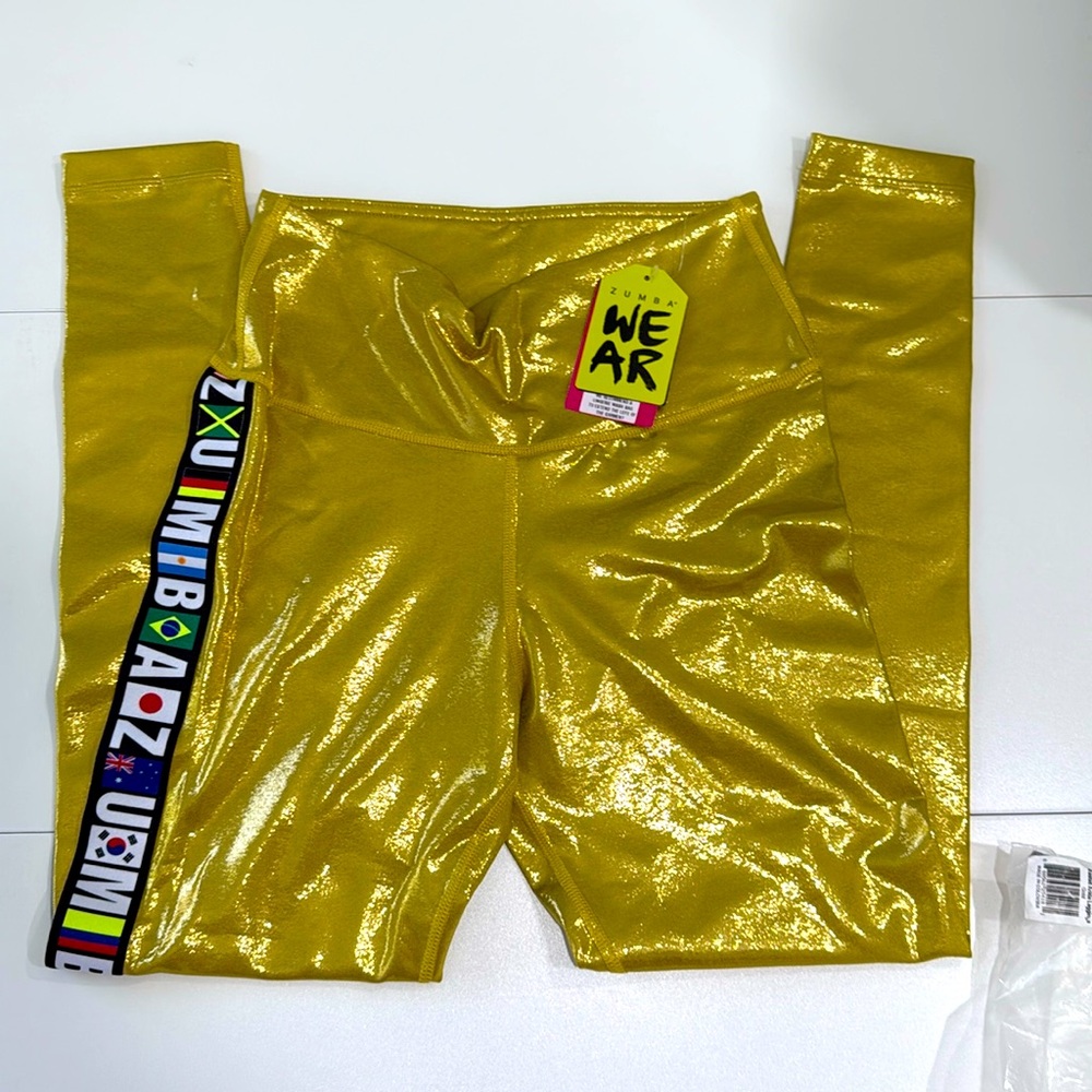 NEW WT! Zumba Marvelous Metallic Gold “world” leggings.